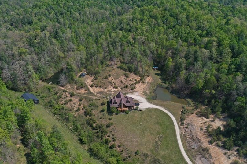 061 aerial view of the home, barn and ponds