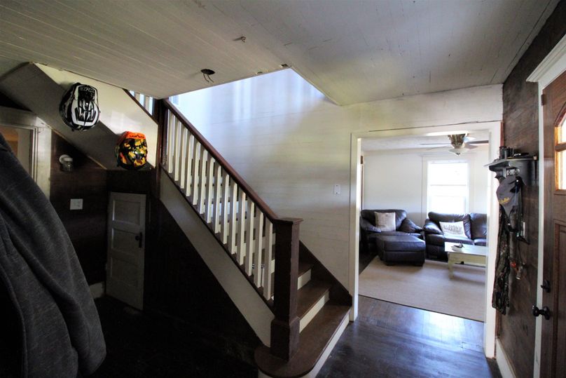 041 entryway and stairway split into the farmhouse