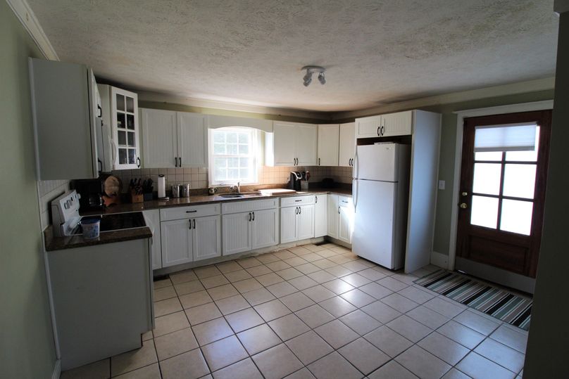 044 kitchen area in the back right portion of the farmhouse