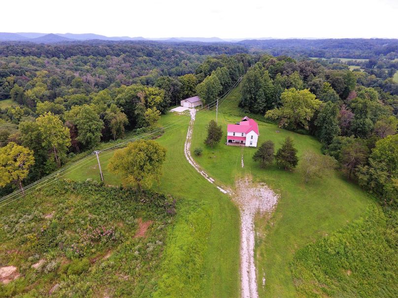 004 drone shot of the farmhouse and new metal shop building