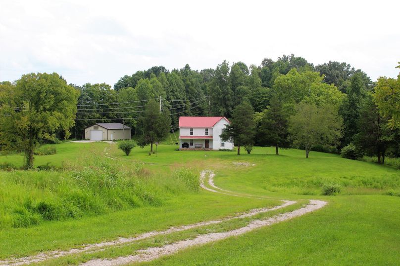 019 view of the farmhouse and new shop building coming down the driveway-2