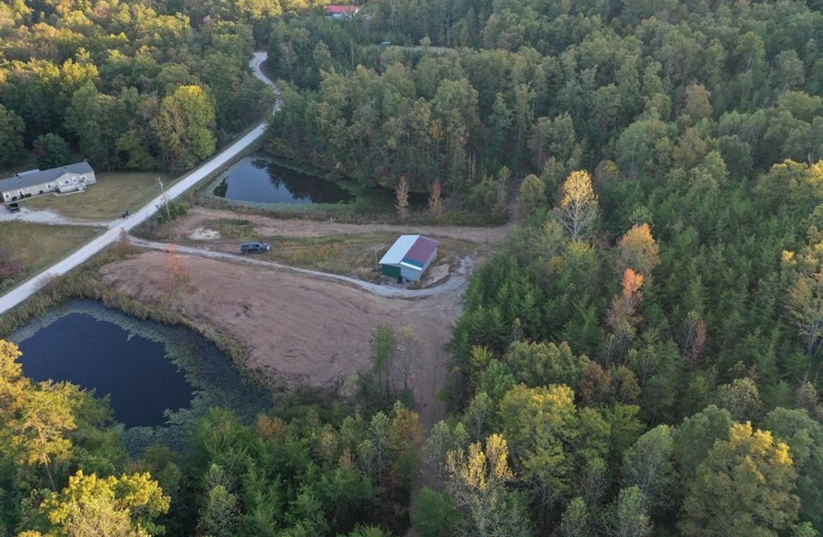 001 view of the east side of the property with building and 2 ponds