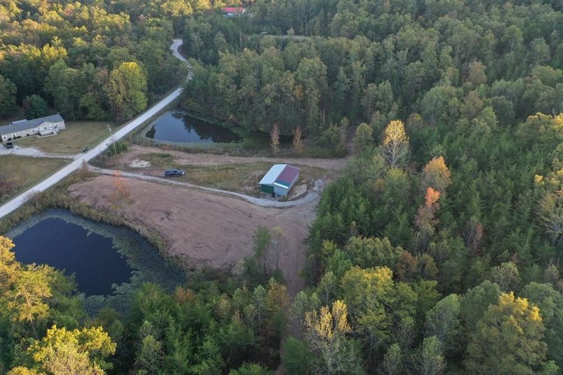 001 view of the east side of the property with building and 2 ponds