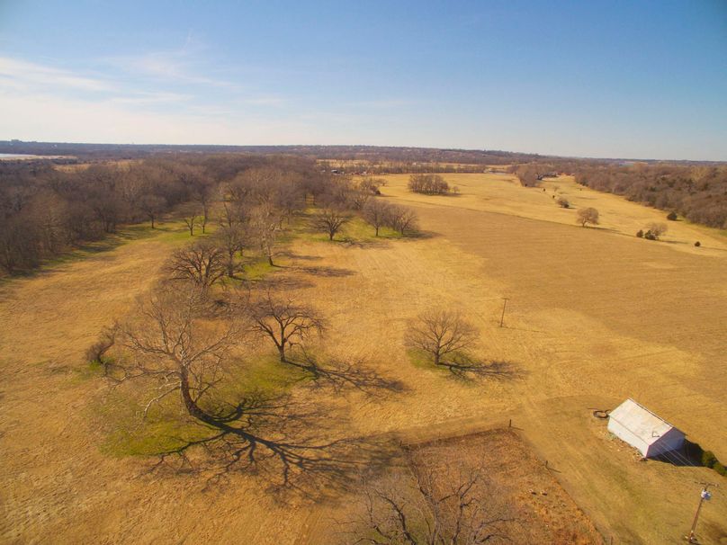 Poncacityok acrage-007 - several storage buildings and pole barn already in place