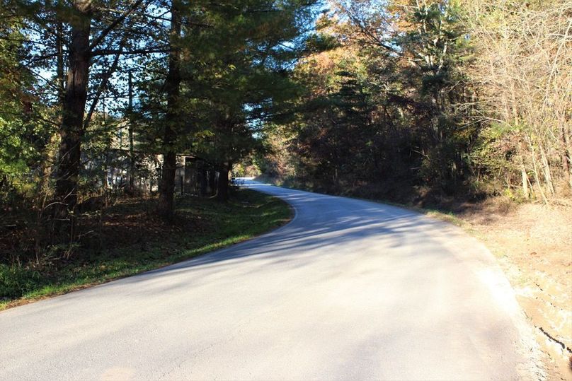 019 Sawmill Road leading along the west boundary