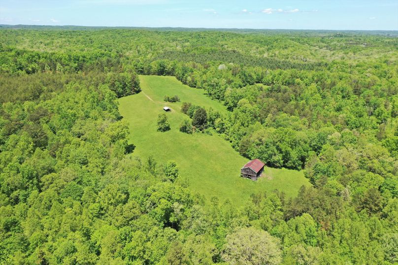 025 drone shot of the old homestead area, fields and the barn