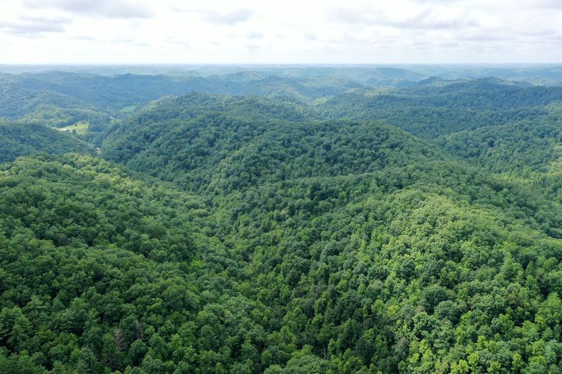 001 breathtaking drone shot across the mountainous landscape from the center fo the property looking southeast