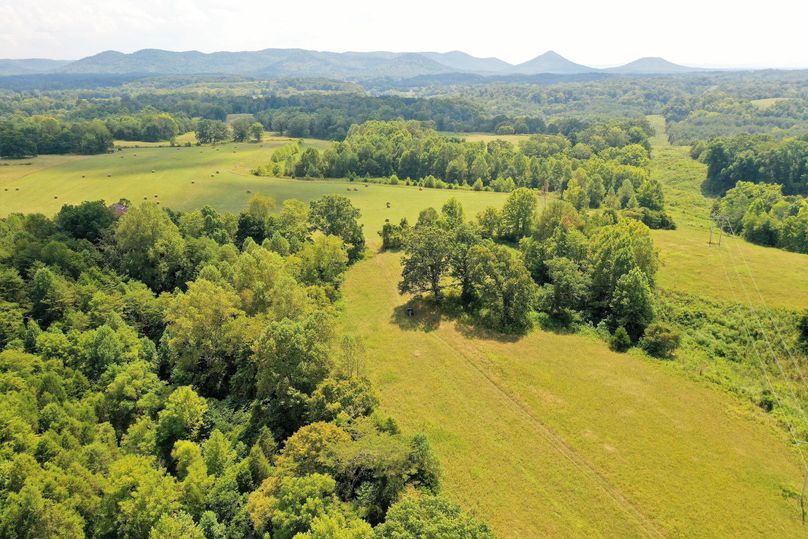 044 drone shot from the center of the property looking southwest into the mountain foothills
