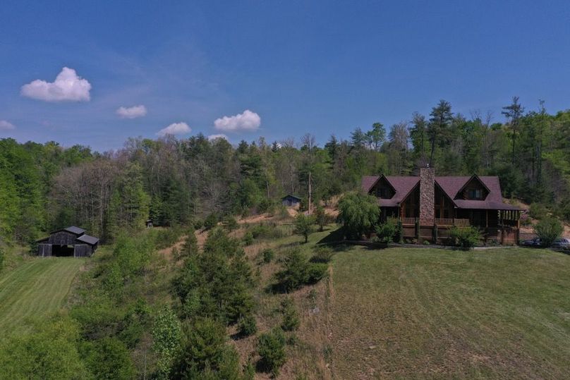 001 low elevation front view of the log home and barn