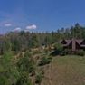 001 low elevation front view of the log home and barn