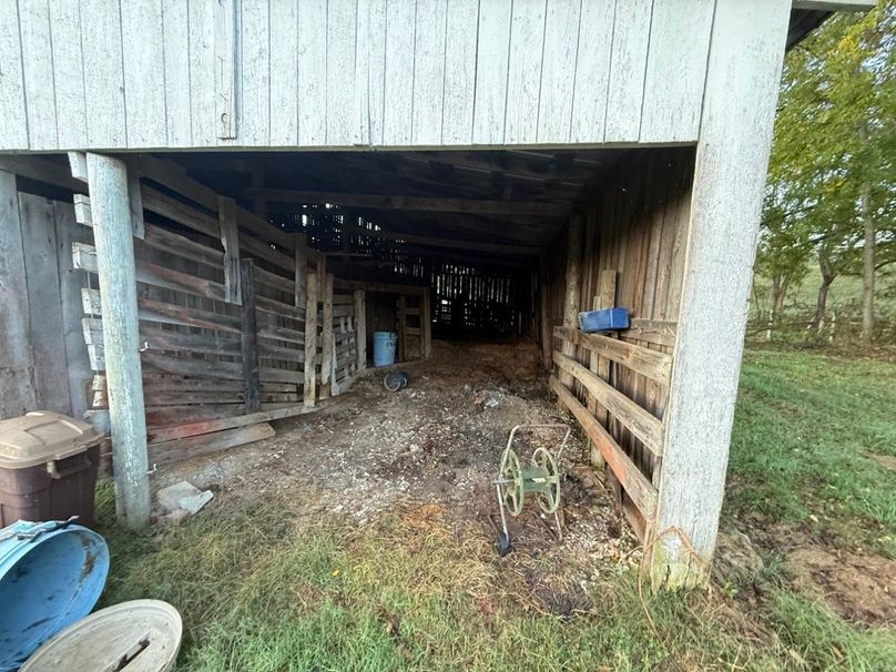 015 Covered livestock area offers sheltered space ideal for cattle or horses.