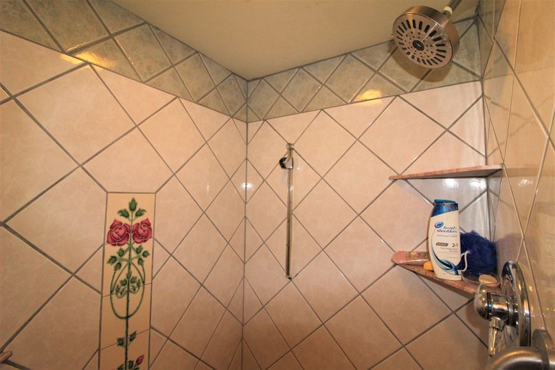 030 ceramic and porcelain tile in the shower of the full bathroom on the main floor