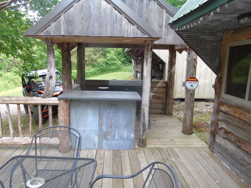 Grill and cook area on porch of office, store