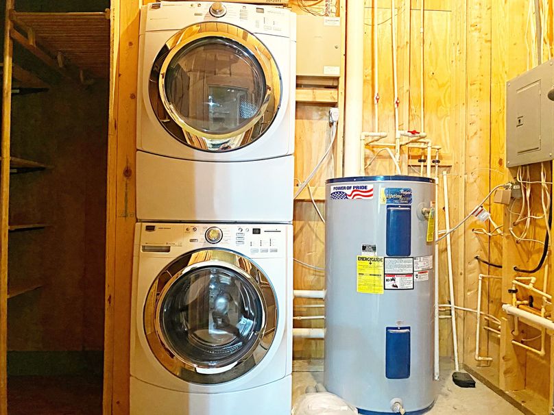 Front loading washer and dryer stay