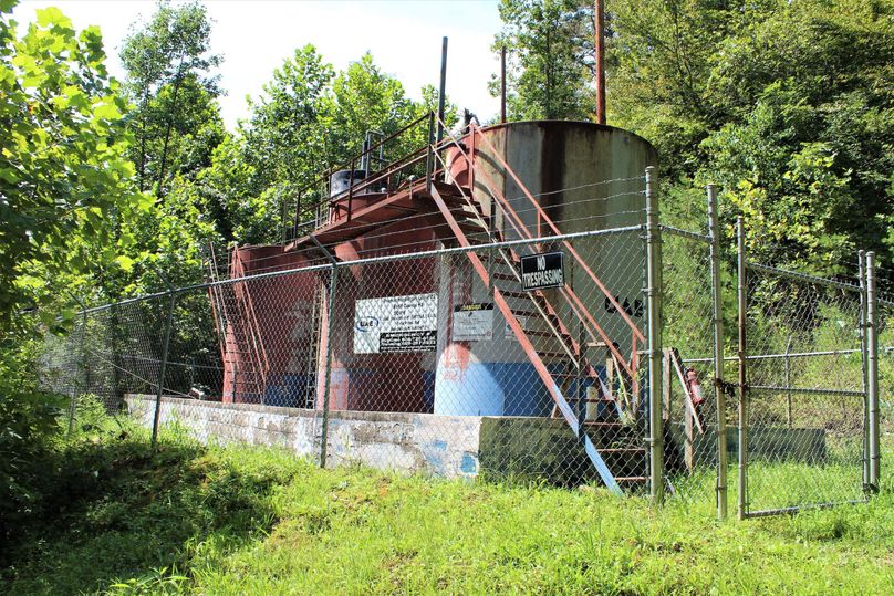 022 oil well storage tanks near the entrance along the gravel road at the south end of the property