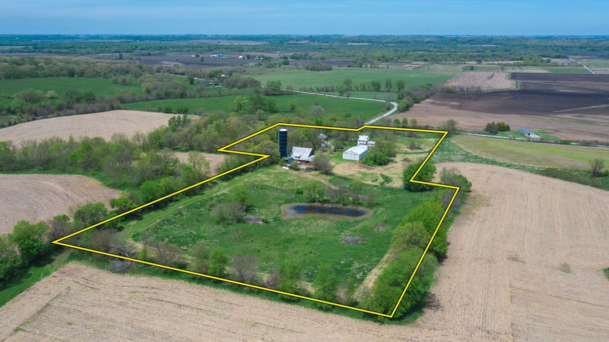 Country Acreage with Historic Farmhouse, Barn, Pond, and Outbuildings