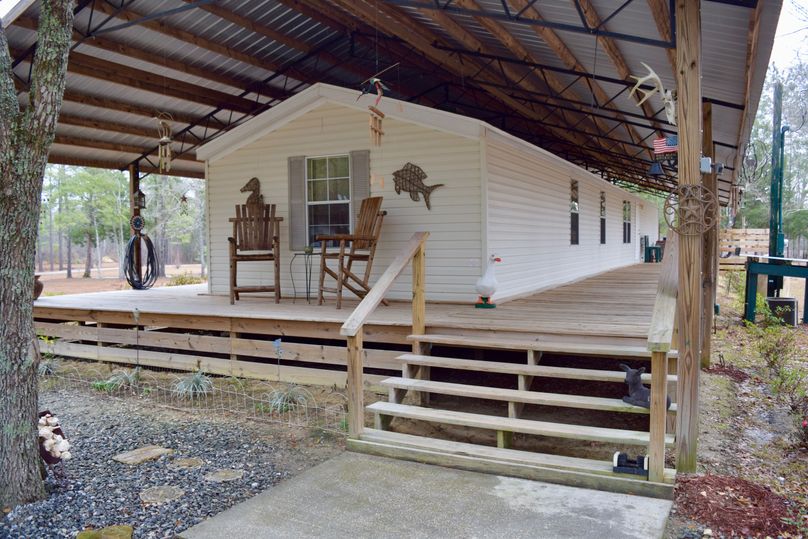 04 mobile home with 8  custom built wrap around porch and 96 x34  overhang-2