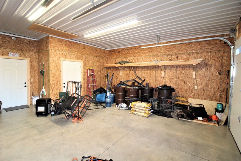 052 one side of the large spacious garage for all your hunting gear and atv s