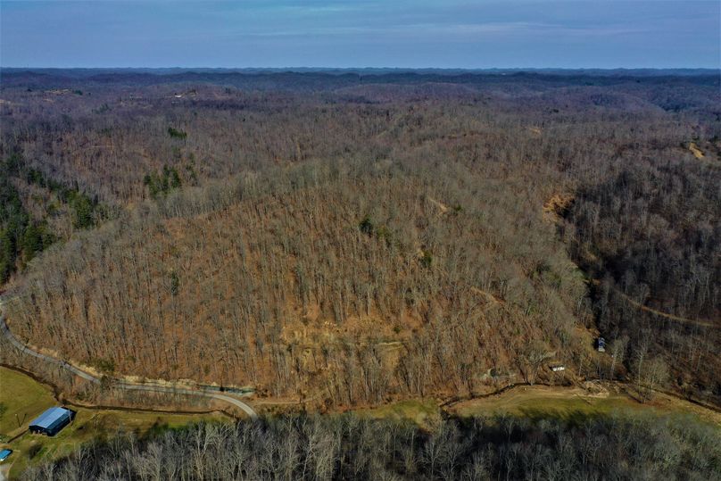 033 aerial drone shot looking east over the property