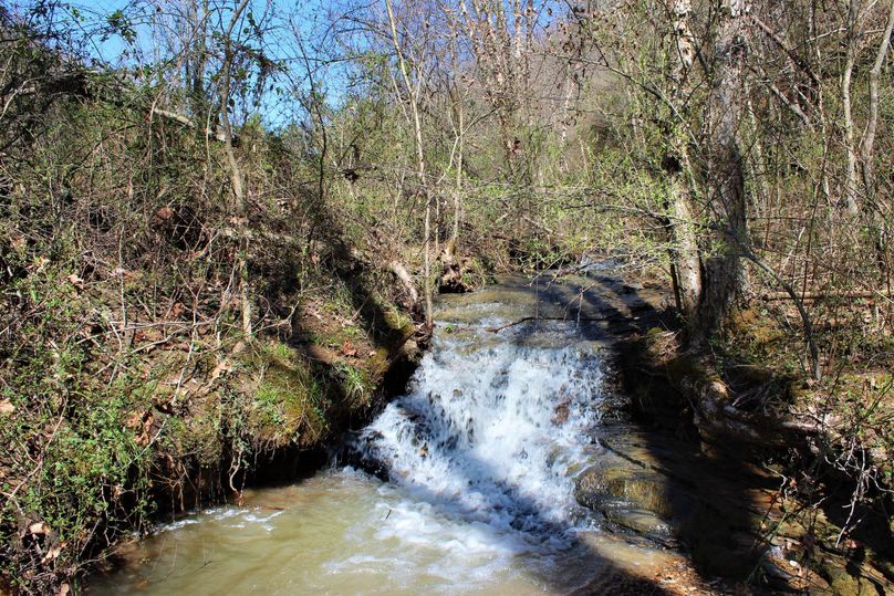 026 a small waterfall down below the pond near the south portion of the property