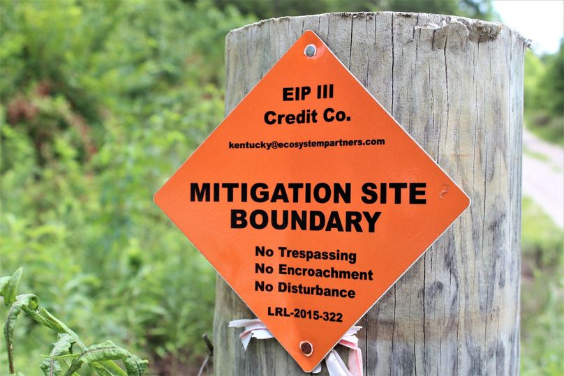 023 the sign showing the mitigation site efforts along the west boundary at the entrance