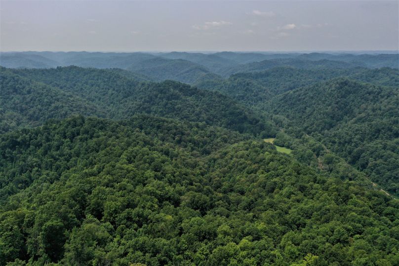 007 aerial drone shot from the center of the property looking northeast down the valley