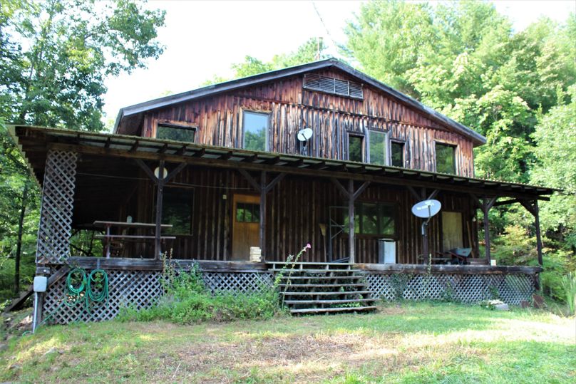 003 the 2 story rustic cabin view from the pond dam