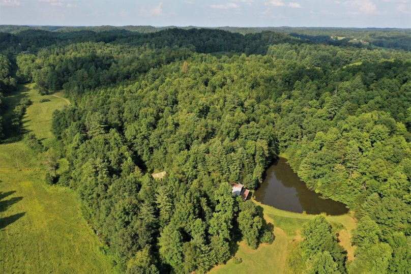 028 high elevation aerial drone shot from overhead at the cabin and pond