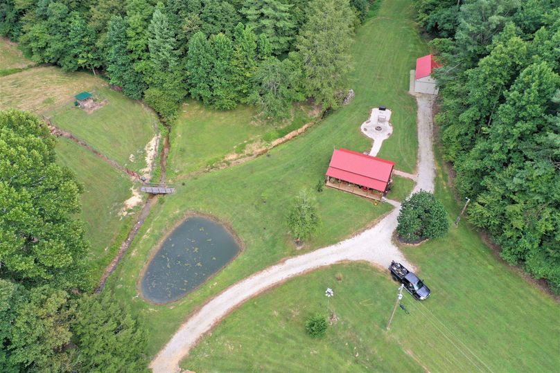 012 aerial shot straight down of the cabin, building, firepit area and pond