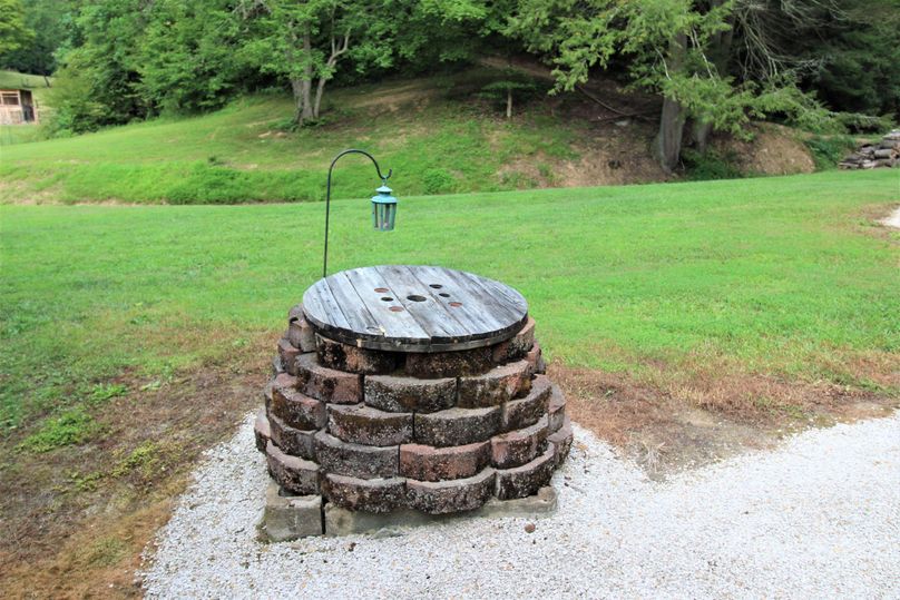 037 the hand dug well just off the back porch area of the cabin
