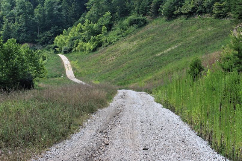 004 the gravel road access leading in from the north