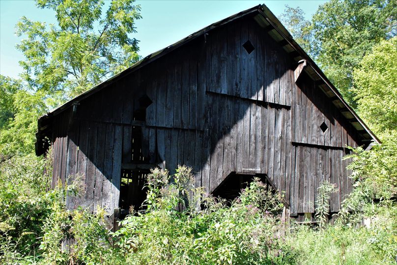 004 the barn sitting along the road on the north side