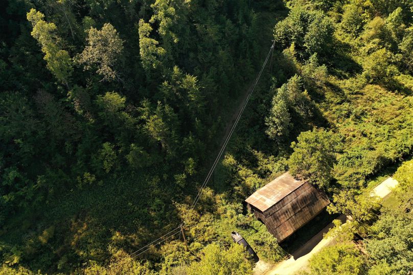 008 aerial drone shot overhead on the barn and field area