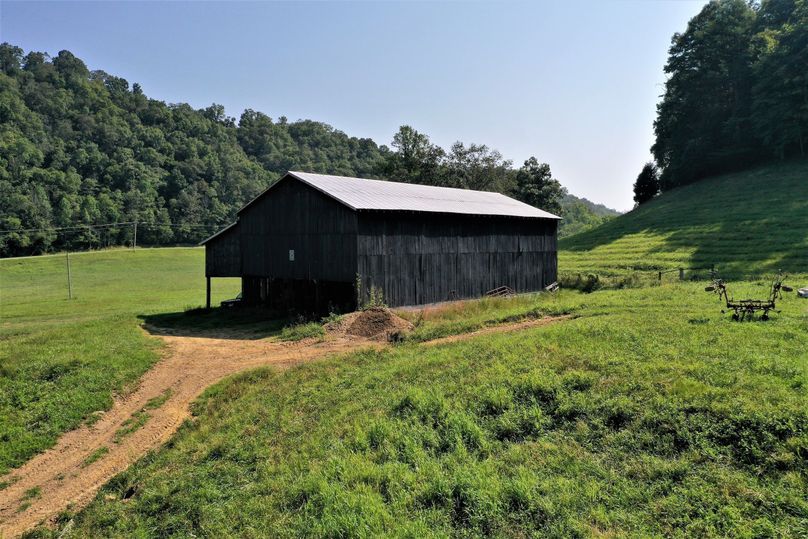 016 the large tobacco barn sitting near the home