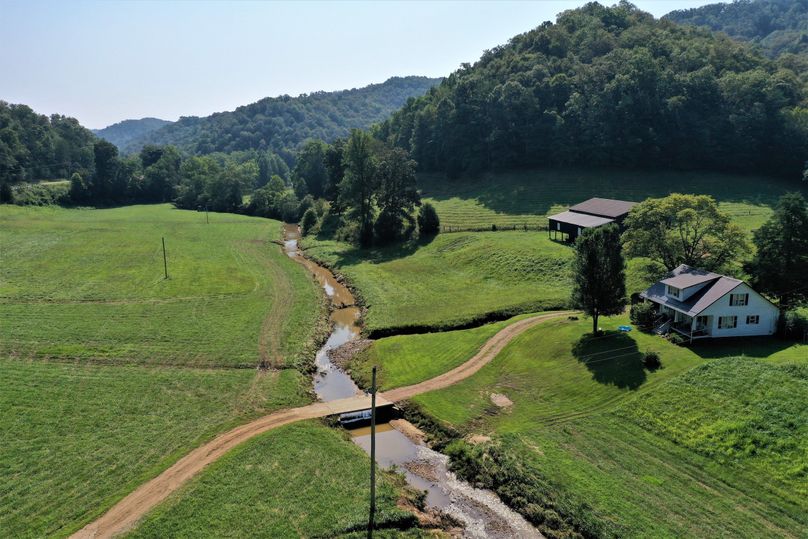 037 aerial drone shot at low to mid elevation looking east up the creek