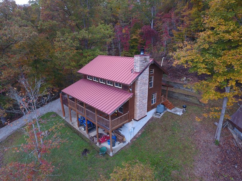 001 low elevation drone shot of the custom built cabin