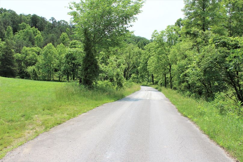 048 beautiful black-top county road providing access to the property at the north end