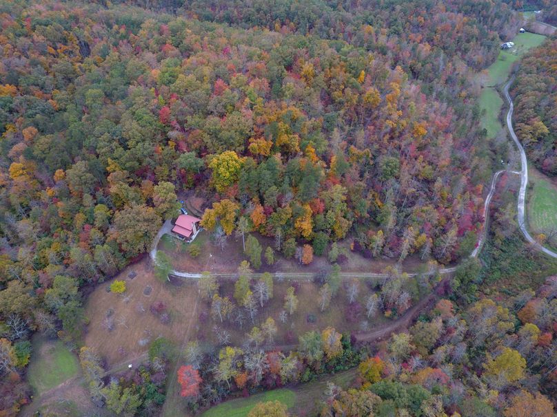 026d aerial drone shot of the cabin and the driveway leading in