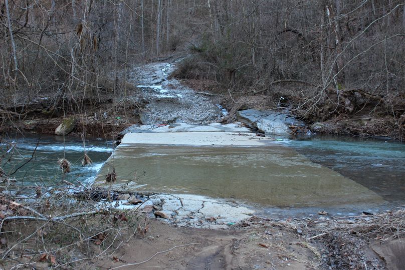 022 the low water bridge leading across the creek to the south portion of the property