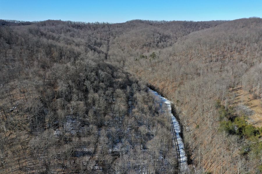 004 aerial drone shot from the south boundary of the property looking north up the valley