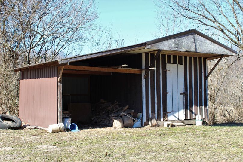028 the woodshed sitting just south of the home near the barn
