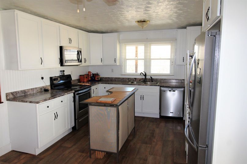032 the kitchen area viewed from the entrance on the porch