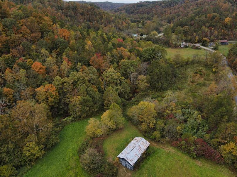 021 aerial view over the barn and bottoms along the creek