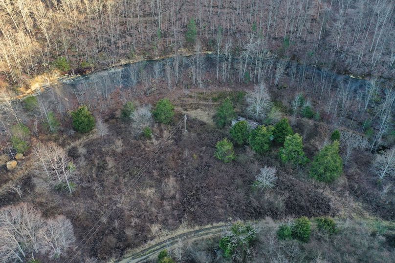022 low elevation drone shot of the old homesite, notice the old mobile home still in place