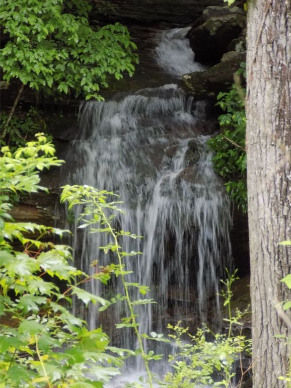 Intermittent waterfall across the road-Not on property