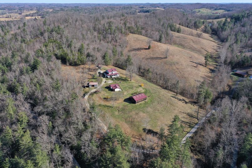 007 mid elevation drone shot from the south of the home, barn, shop and guest house