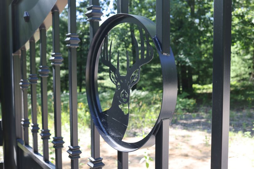 6 Custom Whitetail emblems on entry gates
