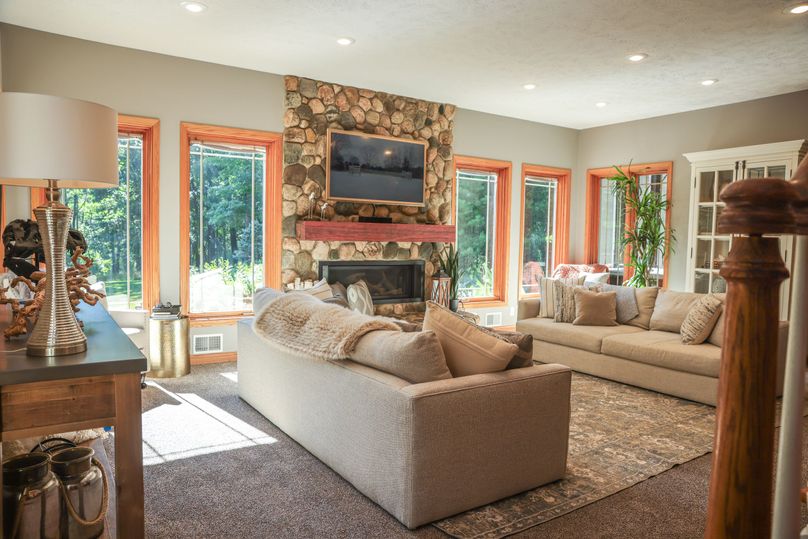 7 Main floor living room with fireplace and tons of natural light