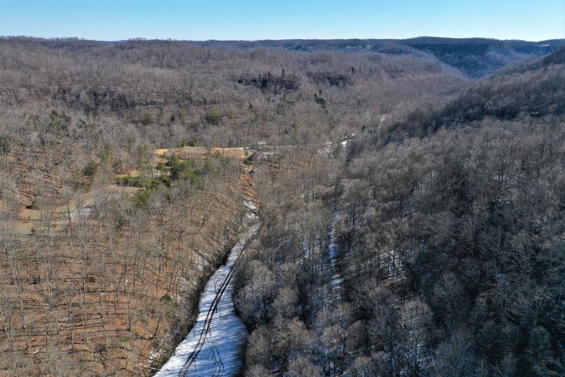 029 aerial drone shot from the center of the property looking southeast toward the blacktop road