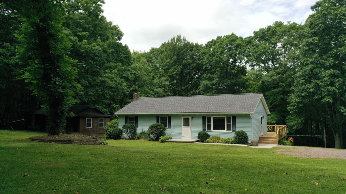 Secluded Wooded Acreage With Home, Garage, And Multiple Outbuildings